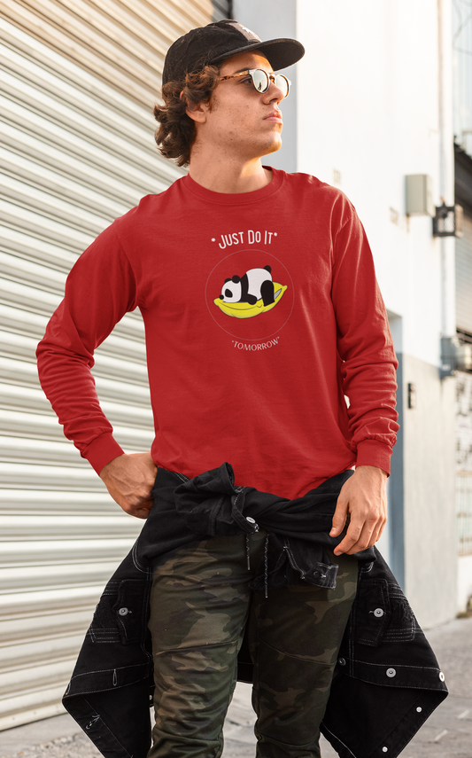 Person wearing a red long-sleeve shirt with a panda design and text, standing outdoors.